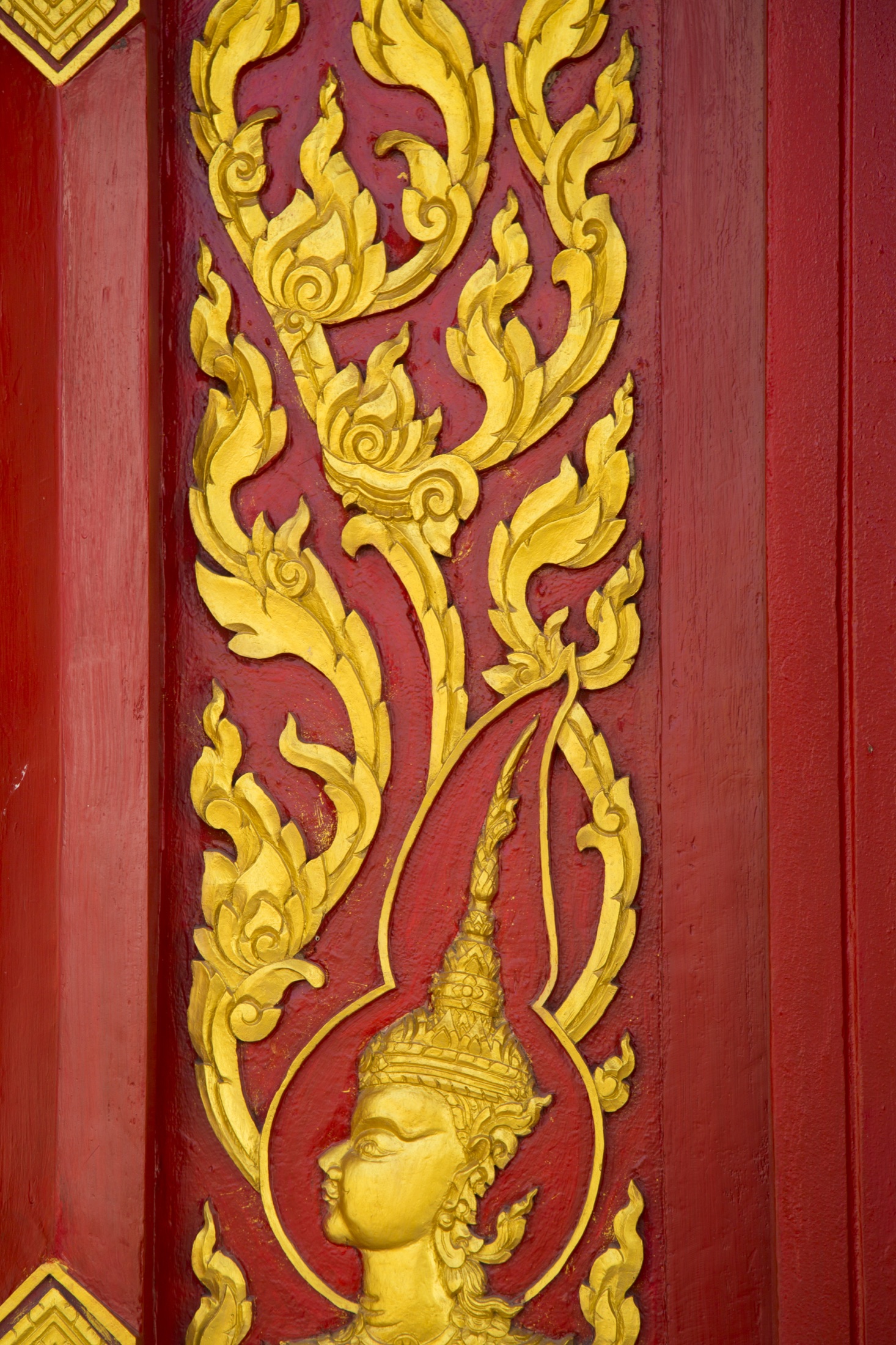 Gold Thai carving on red wood